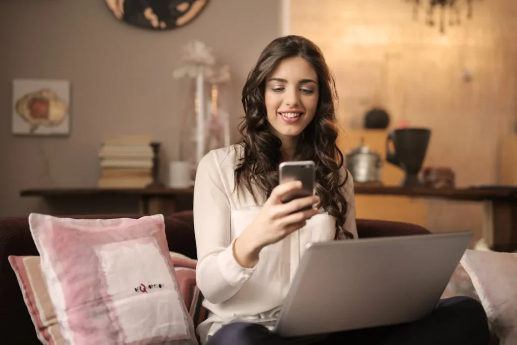 woman in her phone smiling